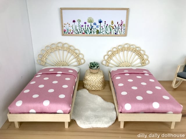 pair of dollhouse beds with boho rattan headboards